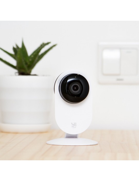 [Y20] YI Home Cámara Vigilancia Cámara IP 1080p sobre fondo en habitación.